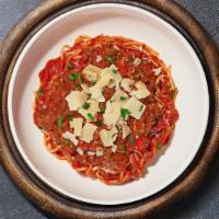 Meaty Sauce Pasta (Spaghetti) · Fresh spaghetti and homemade ground beef served with rossa (red) sauce, red pepper flakes, a...