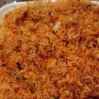 Veggie Biryani · Basmati rice cooked with onions, green peppers combined with fresh vegetables and spices.
