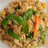 Thai Fried Rice · Stir-fried rice with egg, carrot, pea, carrot, and onions.