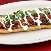 Huarache · Comes with your choice of one meat (or no meat), onion, cilantro, sour cream, fresh cheese, ...