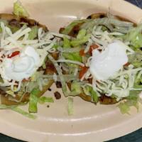 Sope · A fried corn dough with one choice of meat (or fajita veggies) and topped with beans, lettuc...