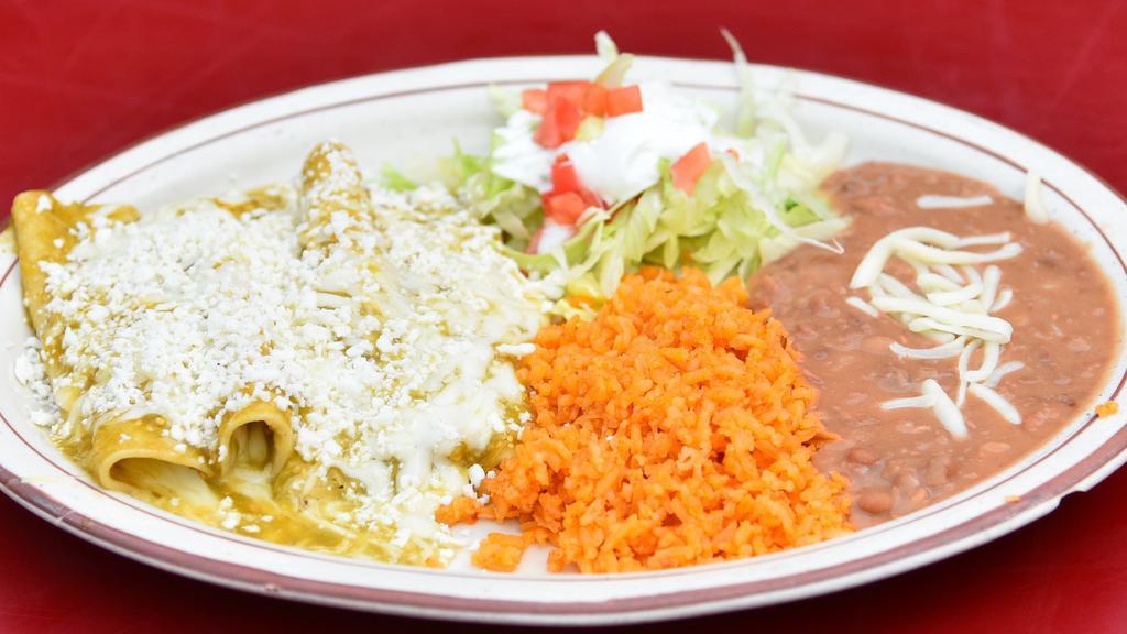 Order Of Enchiladas · Tortillas covered in red or green salsa topped with mozzarella and fresh cheese, with your choice of filling of cheese, shredded chicken, or ground beef. Comes with rice, beans topped with cheese, and lettuce topped with tomatoes & sour cream.
