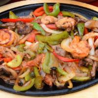 Fajitas · Your choice of chicken, shrimp, steak, or mixed, mixed with green & red bell pepper & onion....