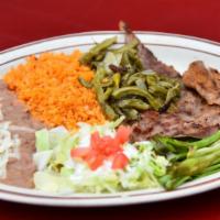 Bistec Asado (Grilled Steak) · Thinly sliced pieces of steak, seasoned and grilled. Topped with grilled green onions and pi...