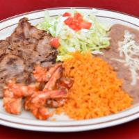 Steak With Shrimp · Thinly sliced pieces of steak with grilled shrimp. Comes with rice & beans topped with cheese.