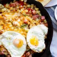 Country Skillet · Ham, sausage, bacon, green peppers, onions, broccoli & mushrooms, skillet potatoes, topped w...
