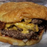 Cheeseburger · Homemade, double patties on a Kaiser bun, topped with sliced American cheese, ketchup, musta...