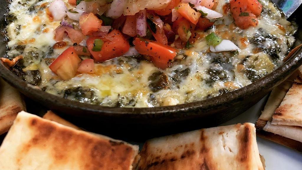 Spinach & Artichoke Dip · Roasted artichokes, spinach, cream cheese parmesan, and mozzarella served with grilled pita chips.