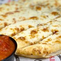 Cheesy Bread Stick · Breadsticks topped with garlic butter and mozzarella cheese and served with a side of marina...