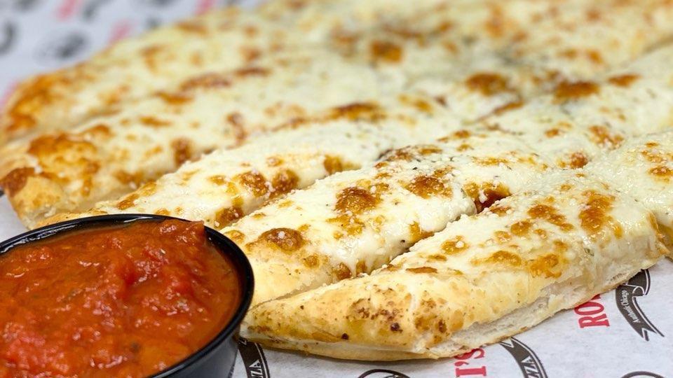Cheesy Bread Stick · Breadsticks topped with garlic butter and mozzarella cheese and served with a side of marinara. 1310 calories.
