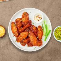 Clucking Wings · Fresh chicken wings breaded and fried until golden brown. Served with a side of ranch.