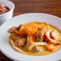 Yellow Curry · Mild spicy yellow curry withcoconut milk, sweet potato, onion, carrot spices, and herbs.