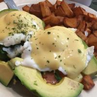 Florentine Benedict · Two poached eggs on a toasted English muffin with sauteed spinach, tomato, and bacon. Topped...