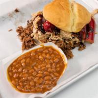 Alpha · Chopped brisket, pulled chicken, hot links, topped with BBQ beans.