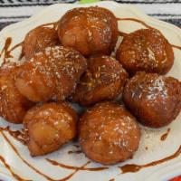 No Name · Fried dough served with cinnamon, powdered sugar and caramel sauce.