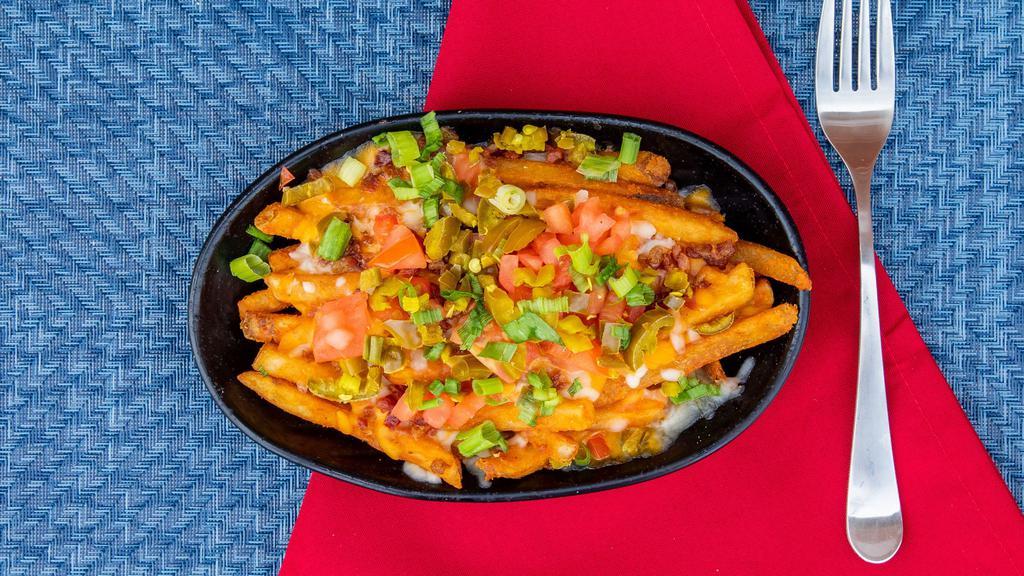 Nasty Fries · Your choice of seasoned, waffle. fries or tater tots topped with. melted cheddar jack (or try our. Nasty’s white queso beer cheese. sauce! ), bacon bits, tomato,. jalapeño, scallions & side of ranch. dressing