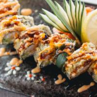 Delicious Roll · Crab, cream cheese, avocado, cucumber, spicy tuna inside. Deep fried and topped with spicy m...