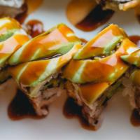 Green Dragon Roll · Eel and cucumber inside rolled over by thinly sliced avocado with eel sauce.