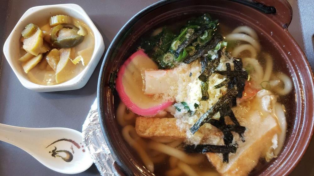 Nabe Udon · Udon noodles with fish cake, vegetables, egg, fried bean curd, and shrimp tempura.