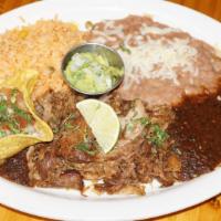 Carnitas · Tender pork carnitas.  Molacajete sauce, pico de gallo & guacamole.  Pinto beans & Mexican r...