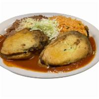 Chiles Rellenos · Egg battered stuffed poblano pepper filled with cheese or beef picadillo.  Roasted tomato sa...