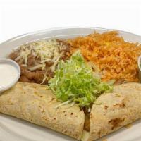 Quesadillas With Meat · 2 Quesadillas filled with cheese and choice of meat on corn tortillas.  Mexican rice & pinto...