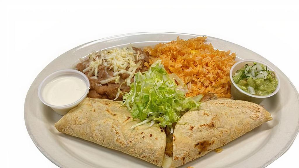 Quesadillas With Meat · 2 Quesadillas filled with cheese and choice of meat on corn tortillas.  Mexican rice & pinto beans.  Sour Cream and guacamole.