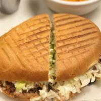 Torta · Telera bread with pinto beans and choice of meat.  Lettuce, sour cream and cheese.  Mexican ...