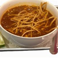 Tortilla Soup · Chicken broth flavored with chile ancho.  Tortilla strips, cheese, chicken & sour cream