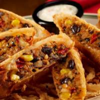 Hogan’S Egg Rolls · Tender wraps filled with chicken, sweet corn, black beans and fresh herbs. Served with house...