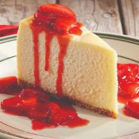 New York Cheesecake · Rich, traditional new york style cheesecake topped with a fresh strawberry sauce.