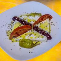 Feta Cheese · Imported Feta cheese topped with our own. Kalamata EVOO. Served with black olives,. pepperon...