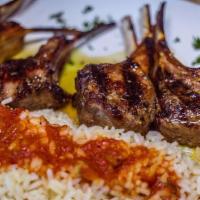 Lollipop Lamb Chops · Marinated with fresh herbs and spices with Greek potatoes and rice pilaf.