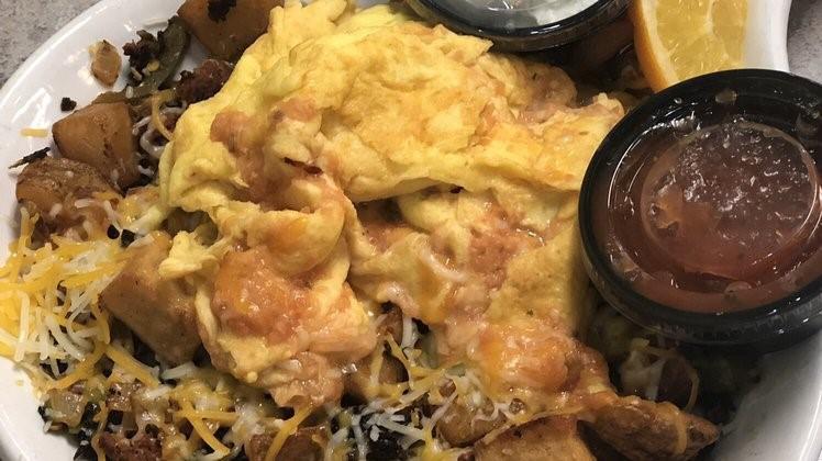 Art’S Famous Skillet · This one is loaded with diced potatoes, spicy chorizo sausage, jalapeños, topped with two scrambled eggs mixed with salsa and Monterey and Cheddar cheeses.