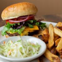 House Burger · Mixed greens , tomato, red onions, bacon, cheddar cheese, and a fried egg.