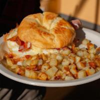 Croissant Sandwich · Grilled croissant sandwich filled with two scrambled eggs, white cheddar cheese and Virginia...