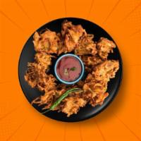 Golden Onion Pakoras  · Finely sliced onions, seasoned and dipped in a traditional spiced pakora batter, and fried t...