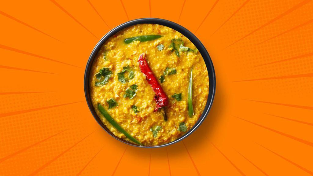 Light Yellow Dal  · 14 oz. Slow-cooked lentil, tempered with tomatoes, onions, green chilis, and Indian spices. Served with a side of aromatic white rice.