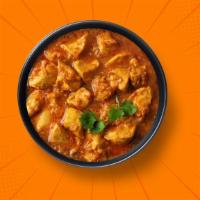 Capital Chicken Curry · 14 oz. Chicken pieces simmered in a brown onion and tomato curry, seasoned with fresh herbs ...