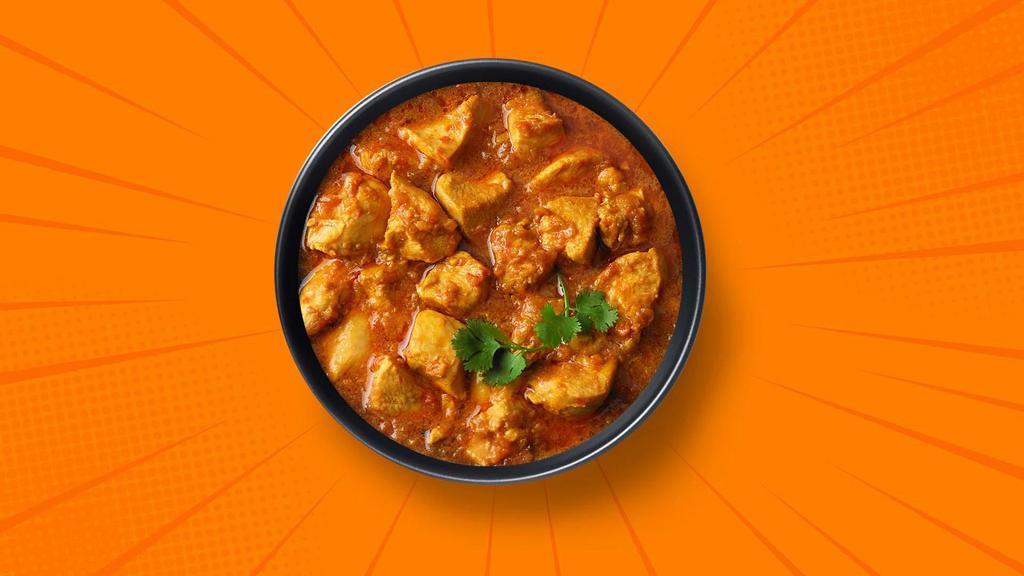 Capital Chicken Curry · 14 oz. Chicken pieces simmered in a brown onion and tomato curry, seasoned with fresh herbs and whole Indian spices. Served with a side of aromatic white rice.