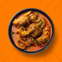 Capital Goat Curry · 14 oz. Tender chunks of goat simmered in brown onion and tomato curry, seasoned with fresh h...