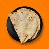 Wheat Chapati  · A light whole wheat flat bread baked to perfection over a pan.