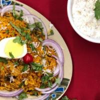 Biryani  · Saffron basmati rice and vegetables are cooked together in a sealed container over very slow...