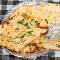 Garlic Naan  · 1 pc. Clay oven baked flat bread flavored with garlic butter chill and topped with sesame se...