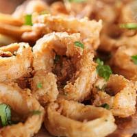 Must Try Calamari · Deep fried calamari with house hot sauce.