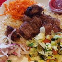 Pork Kebab · Grilled marinated pork shoulder served with steamed rice and sautéed vermicelli, chopped sal...