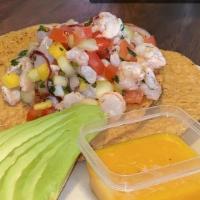 *Tostada De Ceviche De Pescado · Raw fish ceviche tostada. Warning; items marked with an asterisk are served raw or undercook...