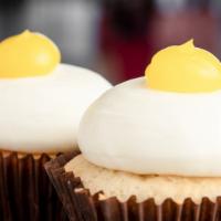 Lemon Drop Cupcake · Vanilla bean cake filled with lemon topped with lemon buttercream and lemon dollop.