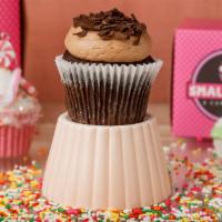 Choco-Holic Cupcake · Chocolate cake with chocolate buttercream topped with chocolate curls.