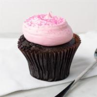 Pink Chocolate Cupcake · Chocolate cake topped with our signature pink buttercream frosting and pink sanding sugar.